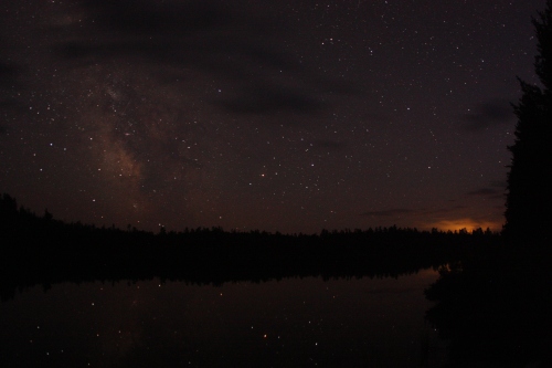 The milky way with lighting off in the distance (lower right corner in the clouds)