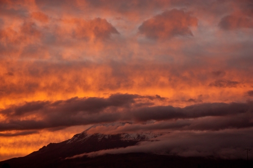 Fiery sunset on Chimborazo as seen from Riobamba